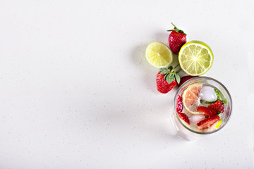 Lemonade with strawberries and lime.