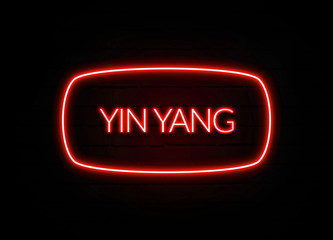 Yin Yang neon sign on brick wall background.