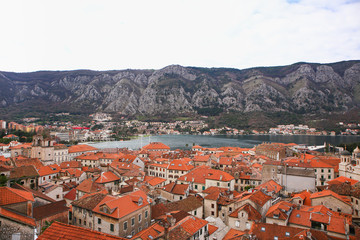 Fototapeta premium Orange roofs of a medieval city. Top view.