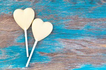 Two white chocolate candy hearts