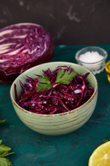 Shredded red cabbage in bowl.