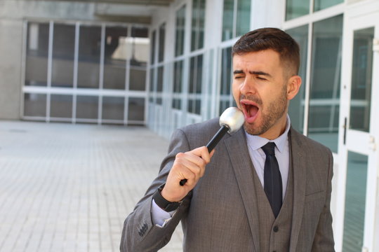 Businessman singing in the office