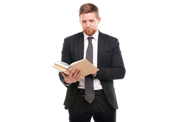 Portrait of young manager holding book