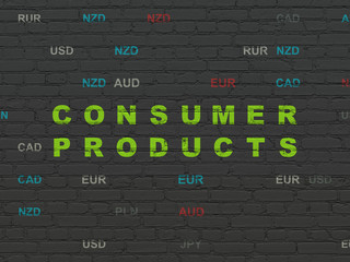 Finance concept: Painted green text Consumer Products on Black Brick wall background with Currency