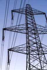 Electricity pylon against a blue sky