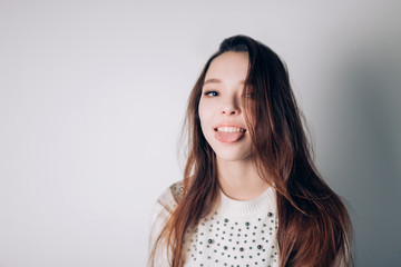 Obraz premium Beautiful woman shows tongue, smiling.