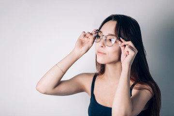 Obraz premium Young beautiful business woman in glasses