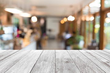Empty wooden table with background blur of coffee shop , product display template.