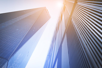 Fototapeta na wymiar Colorful light shines on tall modern skyscrapers in New York City