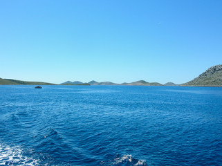 Sea surface aerial view. Background shot of clear sea water surface. Blue sea water in calm. Sea texture. Background blue waves.