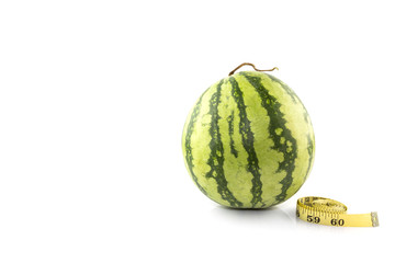 Diet concept Fresh green melon with measuring tape