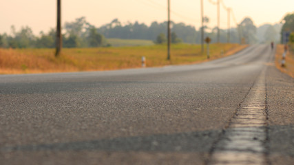 Asphalt road in the evening at Khao Yai National Park, Thailand.
