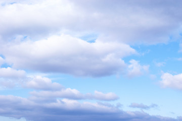 Light Blue sky with white cumulus clouds background