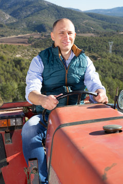 Farmer sitting in tractor
