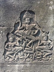 Apsara dancers carved on the wall of Khmer ancient temple.  Angkor Wat in Siem Reap, Cambodia. 
