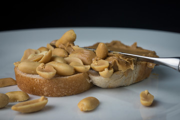 Peanut butter sandwich being made