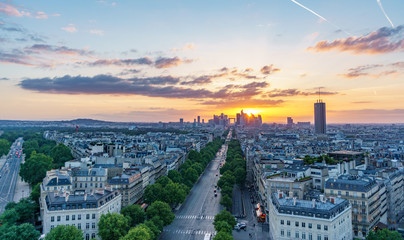 Sunset skyline of Paris with la defense and roofs