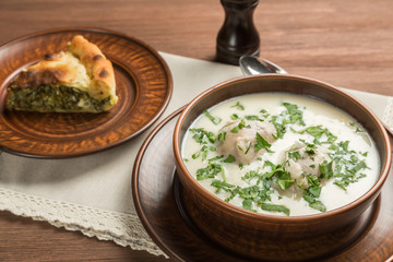 Greek lunch of soup avgolemono and closed the pie spanakopita. Close up