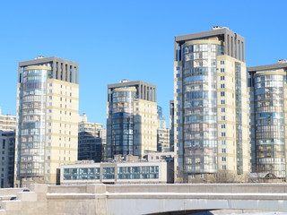 river in ice, city quarter in winter, frosty day