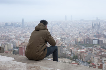 Fototapeta na wymiar Man with Barcelona view