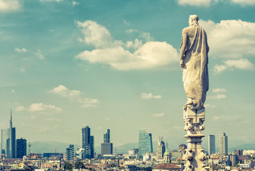 Milan skyline, Italy. Statue of Milan cathedral roof on sky background.