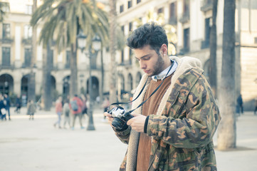 young man with an analog camera at Barcelona