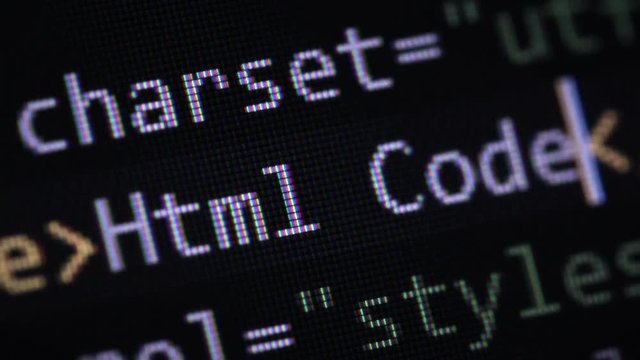 Closeup of creating HTML page. Website development. Typing Html code title on computer screen