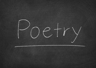 Obraz premium poetry concept word on a chalkboard background