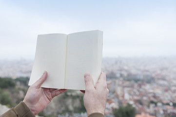 hands holding a book