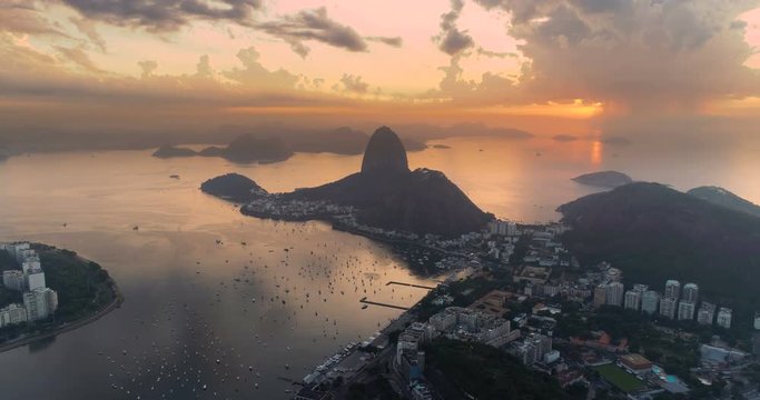 Flying above the bay towards sunrise over Sugarloaf Mountain in Rio de Janeiro, Brazil.