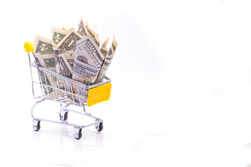 Dollar bill collect on shopping cart.Concept of money havesting from American dollars