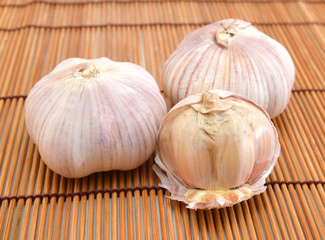 fresh garlic isolated on bamboo mat