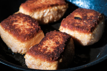 fried cutlets on a frying pan