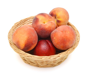 Fototapeta na wymiar Ripe peach fruit isolated in basket on white background