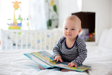 Portrait of a cute  infant baby boy. Happy childhood concept. © Tomsickova