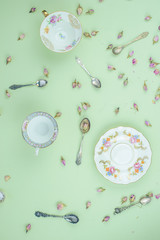 Tea party concept, with porcelain plates and antique silver teaspoon