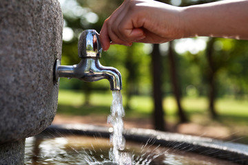 Open water tap for drinking in a park 