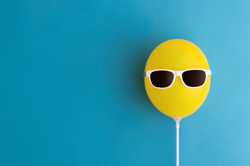 Yellow balloon with sunglasses