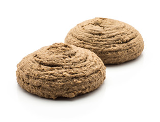 Two cocoa oat cookies isolated on white background brown round crispy.