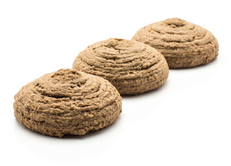 Three cocoa oat cookies isolated on white background brown round crispy in row.