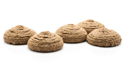 Five cocoa oat cookies isolated on white background brown crispy drop shape.