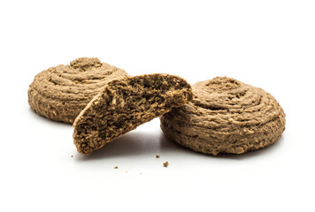 Two cocoa oat cookies one cracked half isolated on white background drop shape brown crispy biscuit.
