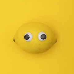 Yellow lemon face with comedy googly eyes