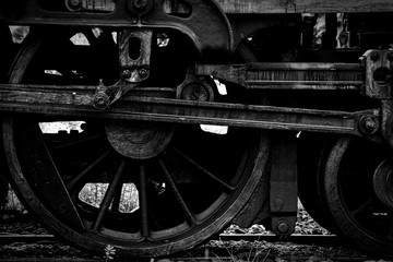 old steam locomotive wheel and rods - monochrome
