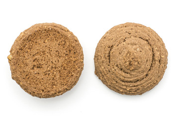 Two oat cookies brown round and crispy isolated on white background top view.