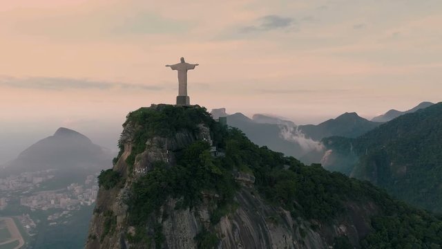 Aerial View Of Christ The Redeemer Statue at sunrise. Rio de Janeiro, Brazil