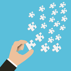 Vector of hand of businessman holding pieces of jigsaw. Hand with jigsaw.
