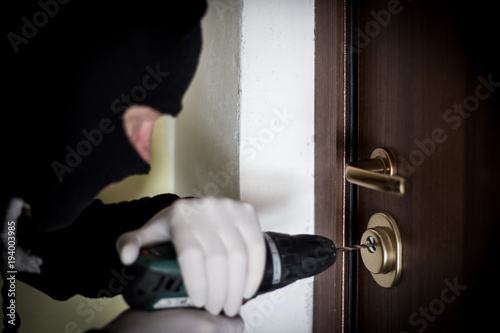 Crime Robbery Masked Thief Burglar Trying To Break Into A Flat Crime Robbery Masked Thief Burglar Trying To Break Into A Flat