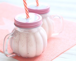 Healthy strawberry smoothie in a mason a jar mug