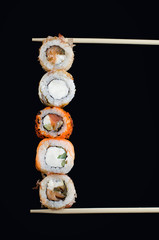 Japanese rolls on a dark background